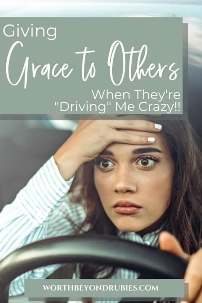 An image of a woman sitting behind the wheel of her car with one hand on the wheel and one on her head with a look of disbelief on her face and text that says Giving Grace to Others When They're "Driving" Me Crazy!!