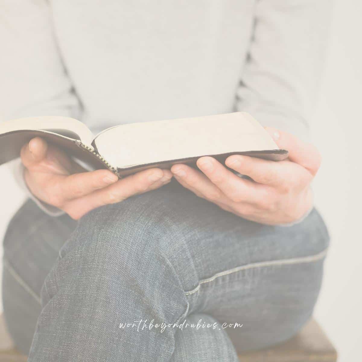 a woman holding a Bible open on her lap