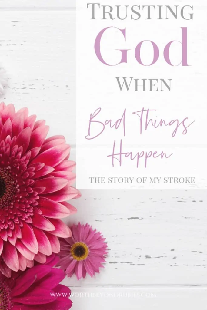 How to Trust God When Bad Things Happen - Pretty pink flowers on a white washed wood background