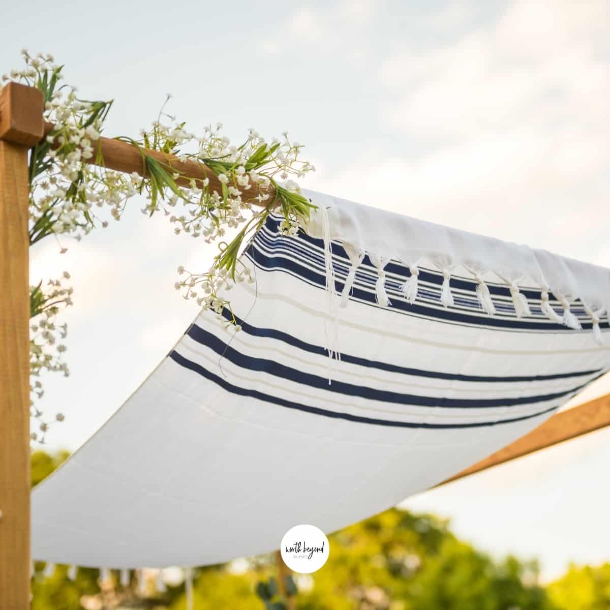 a chuppah with a Jewish prayer shawl over it for post called Jesus the Bridegroom and the Ancient Jewish Wedding