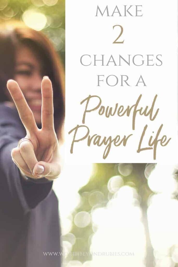 A woman smiling holding up her fingers in a peace sign with a text overlay that says Make 2 Changes for a Powerful Prayer Life