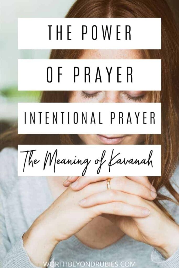 An image of a red-headed woman in a gray shirt sitting at a table with her hands folded in prayer and text that says The Power of Prayer - Intentional Prayer or Kavanah