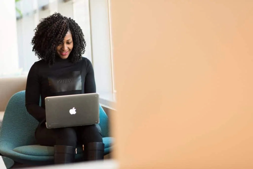 Adult African American Woman Woman Holding Macbook