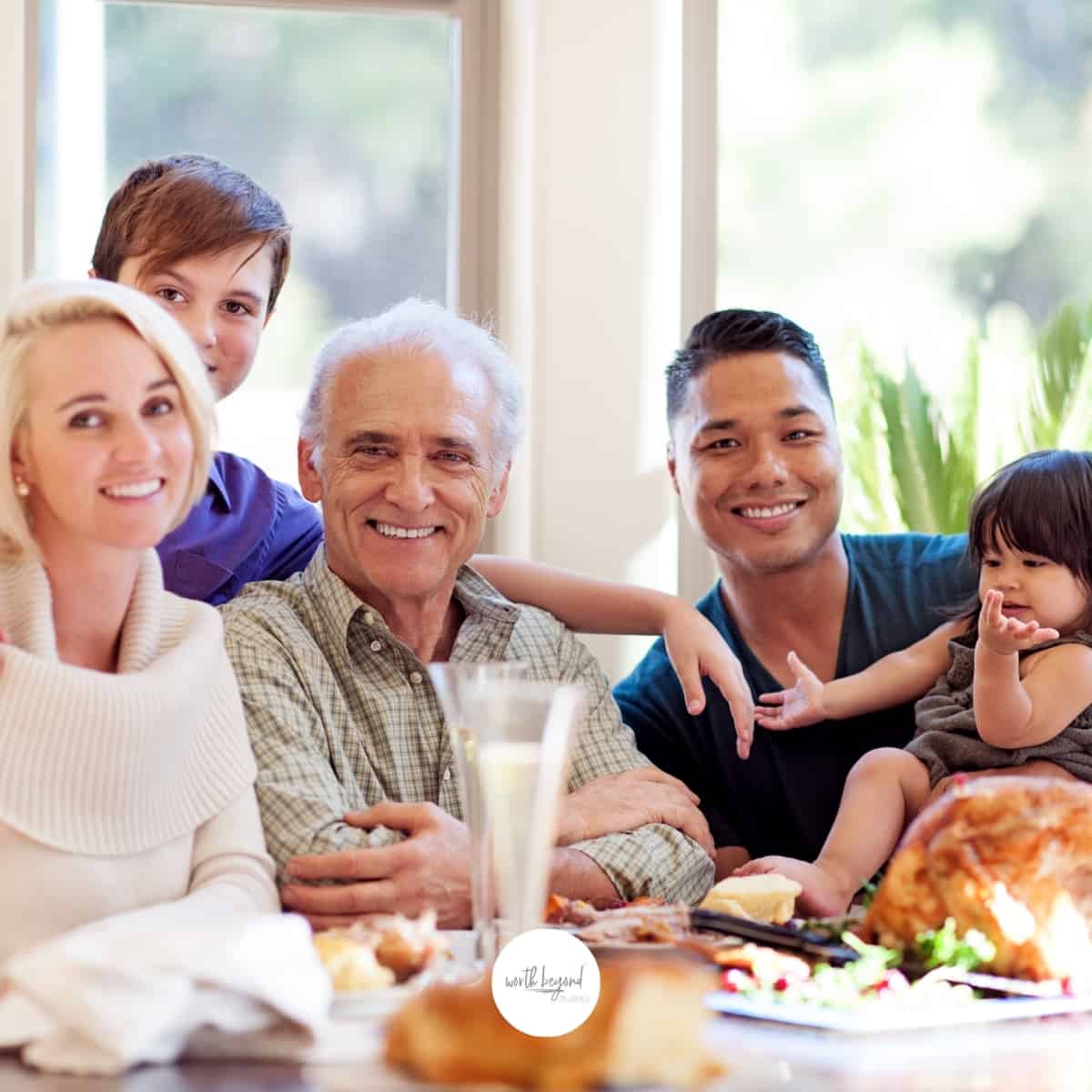 an image of a family gathered around the table at Thanksgiving dinner for post called Surviving the Holidays When You Have Anxiety - 5 Methods to Get You Through!
