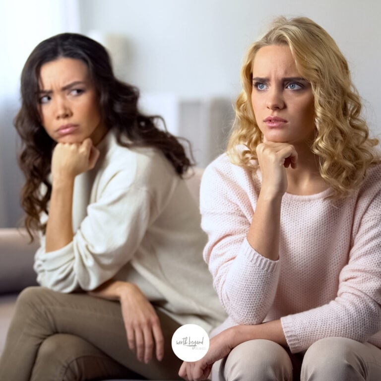 two women looking like they are angry with eachother and the worth beyond rubies logo at the bottom of the image