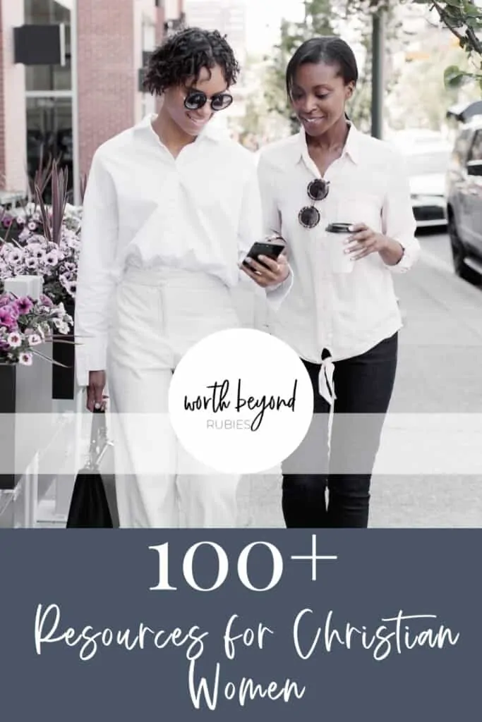 2 black women walking down a city street, one holding a cell phone and the other holding a cup of coffee while they smile looking at the phone and text that says 100+ Resources for Christian Women