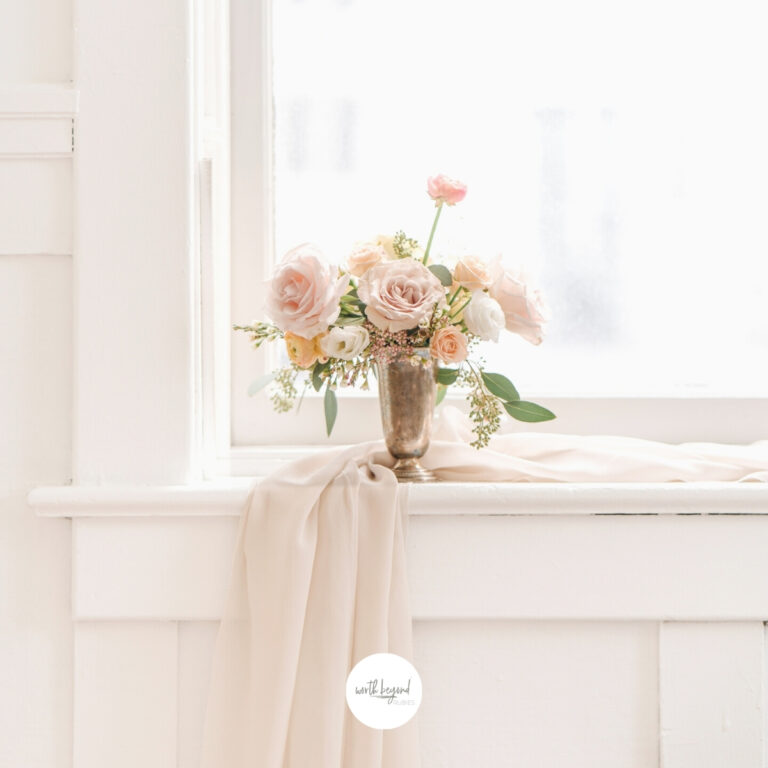 An image of flowers and a blanket in a room by a window for post called How to Trust God When Bad Things Happen - God is With Us