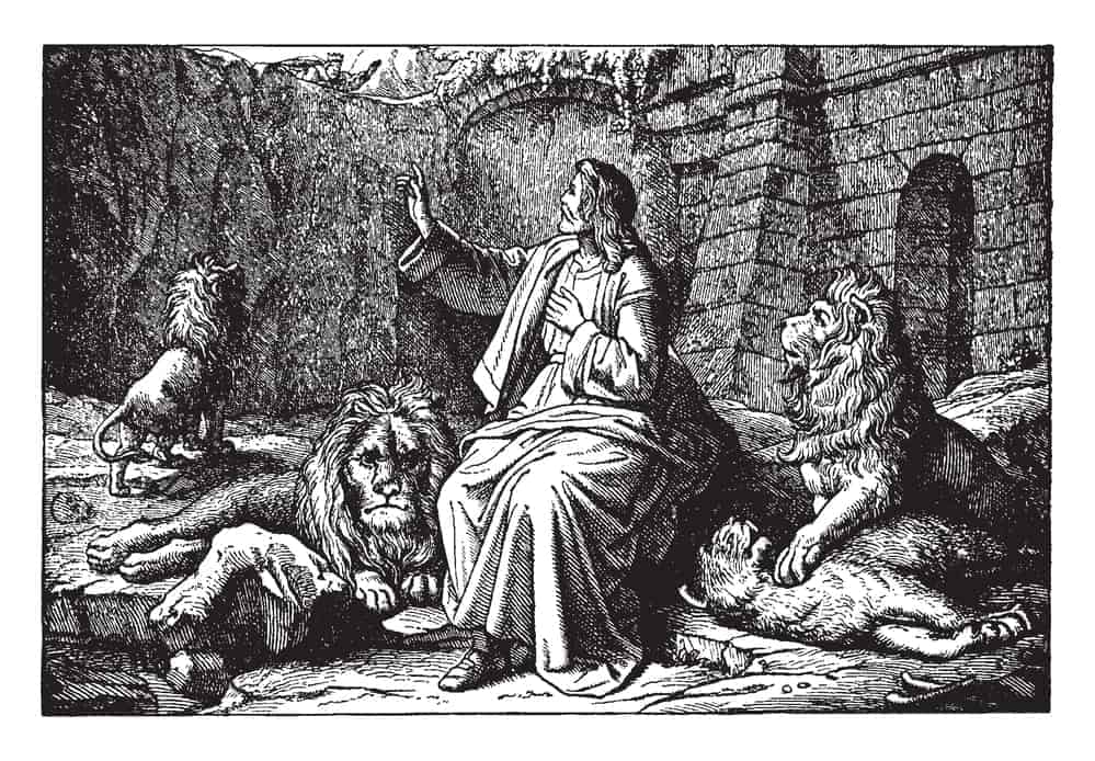 Animals in the Bible: 14 Stories of Animals in Scripture 4 An ancient picture of Daniel sitting safely around the lions in the den. Daniel is looking up to the edge of the pit, where a king can be seen looking down on him, vintage line drawing or engraving illustration.; animals of the Bible