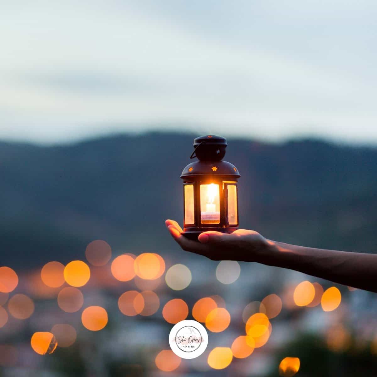 a hand holding a lantern for Proverbs 31:18
