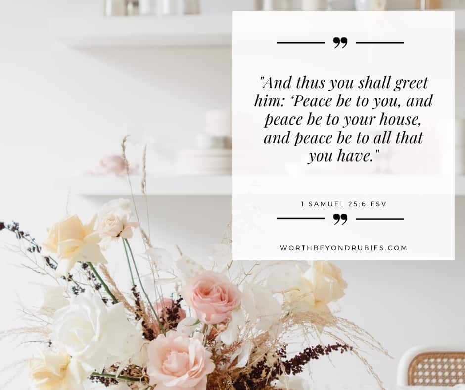 an image of a bouquet of flowers on a table with dishes on shelves in the backdrop and with a text overlay with 1 Samuel 25:6 quoted from the ESV version for post on praying over your home