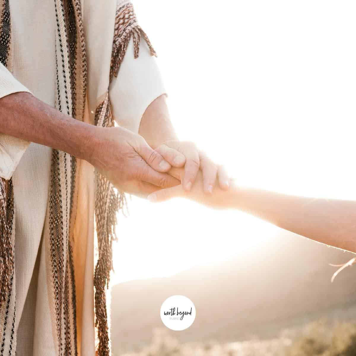 An image of a man's hands reaching out for a woman's hand as an image of Jesus reaching out and the Worth Beyond Rubies logo at the bottom of image - for post on Jesus as Mediator or Middleman