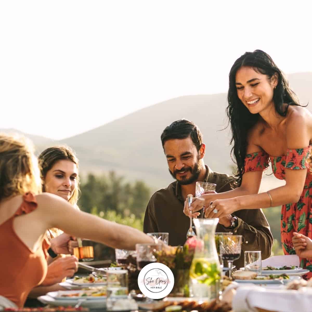 a group of people at a table for hospitality in the Bible