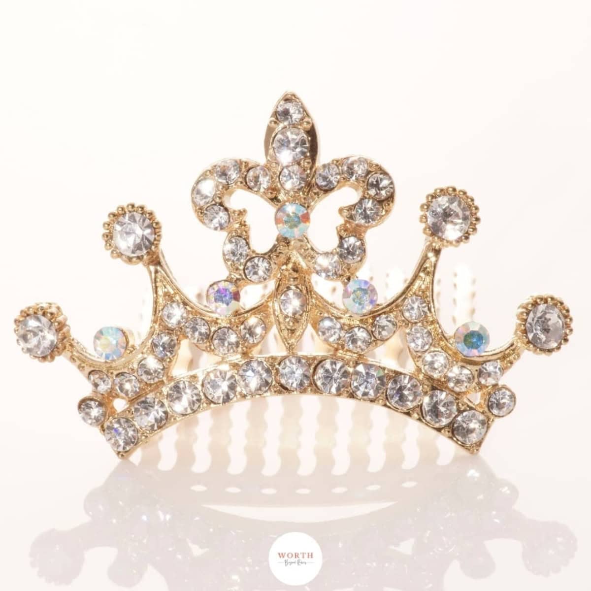a gold crown with diamonds and a white background.