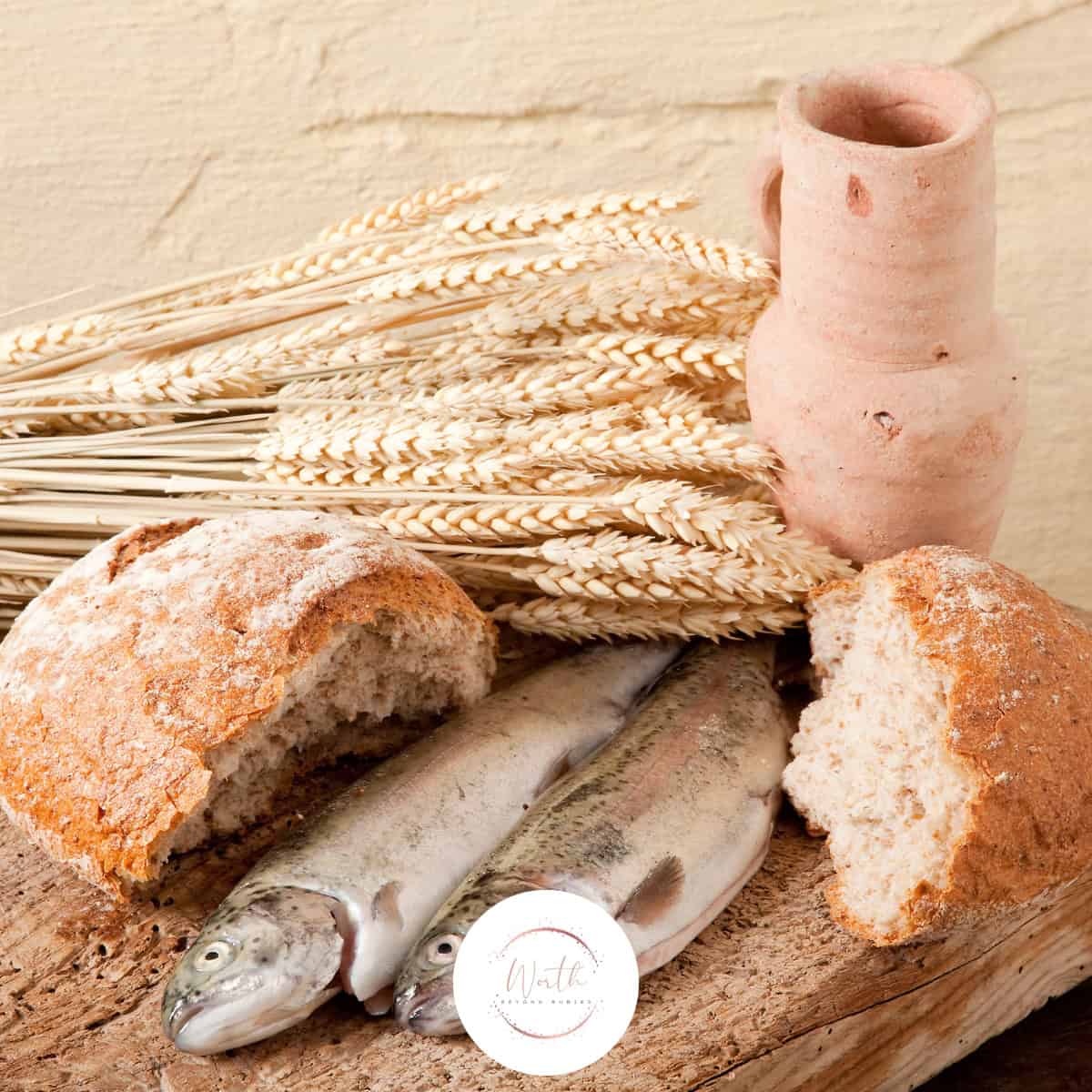 a fish and bread with wheat ears