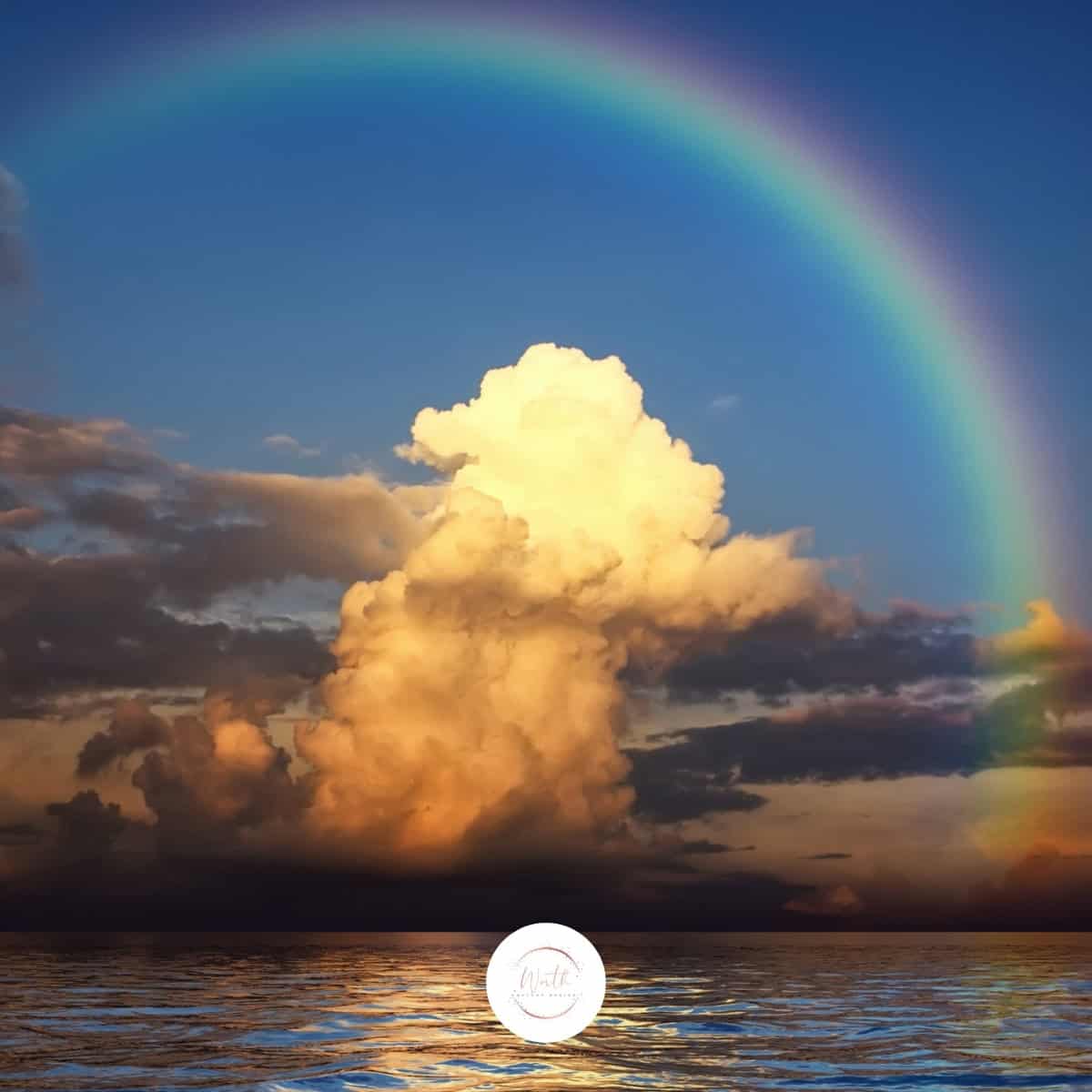 a rainbow over water and clouds
