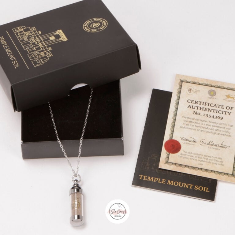 a necklace in a box with a certificate and a box with a tag